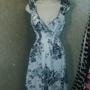 White cotton dress with black floral pattern
